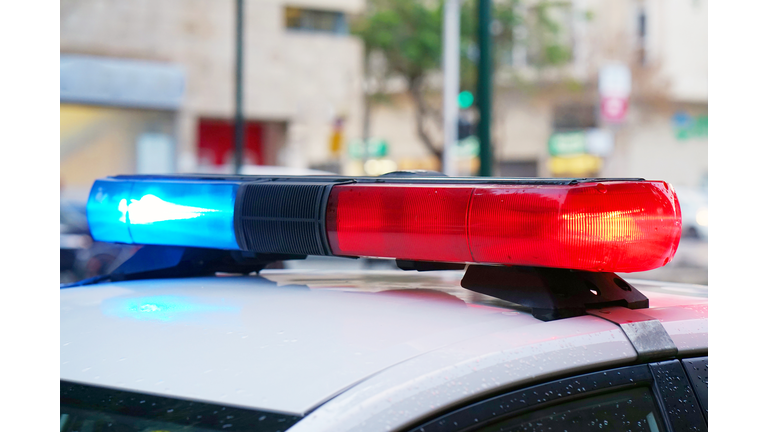Blue and red lights on top of police car