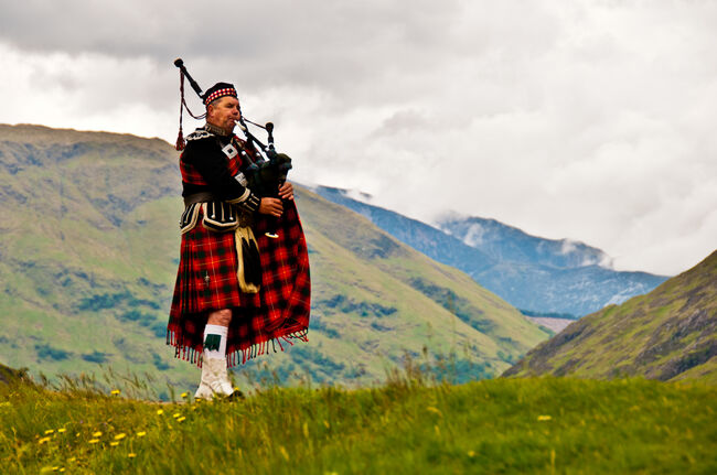 Highland bagpiper in kilt