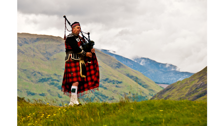 Highland bagpiper in kilt