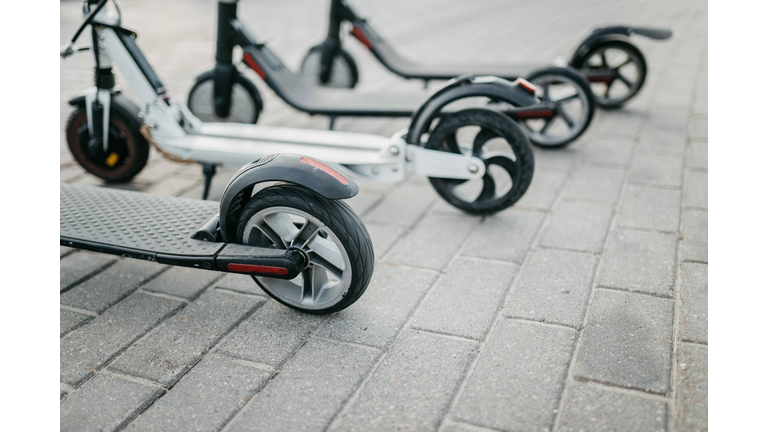 Electric scooter rental in the city. The problem of traffic jams, environmental transport in the city.