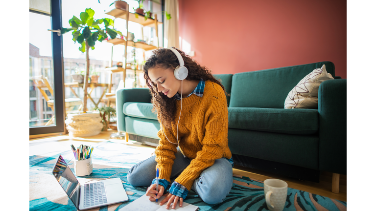 Woman working online from her living room