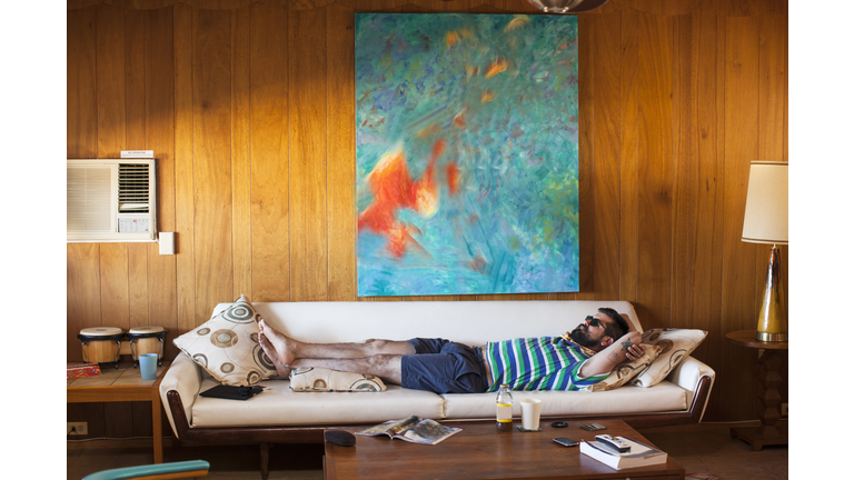 Man laying on sofa