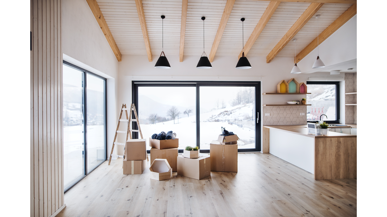 Moving boxes in modern living room in a new home.