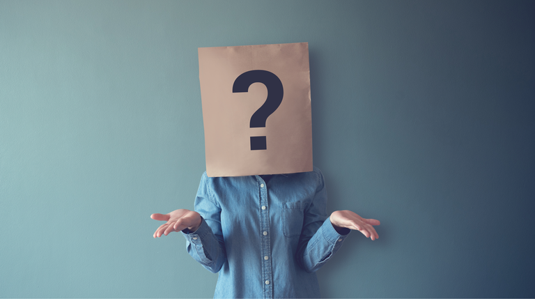 Woman has Confused, Thinking, Question Mark Icon on Paper Bag, copy space.