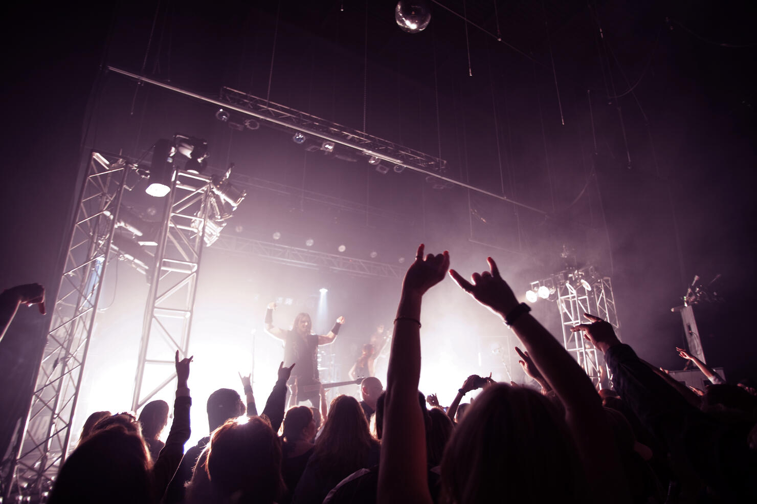 Happy audience enjoying rock music concert