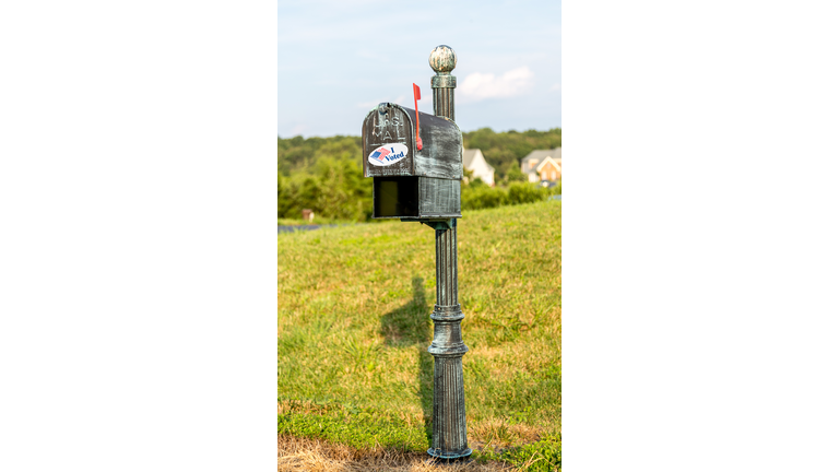 USPS metal mailboxes for rural homes with I voted sticker for vote by mail