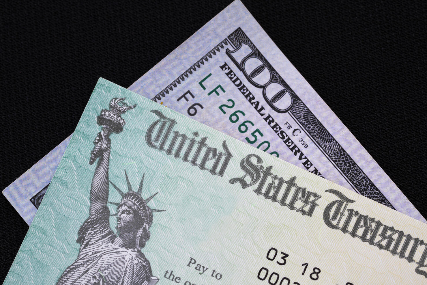 Treasury check with hundred dollar bill - corona virus relief