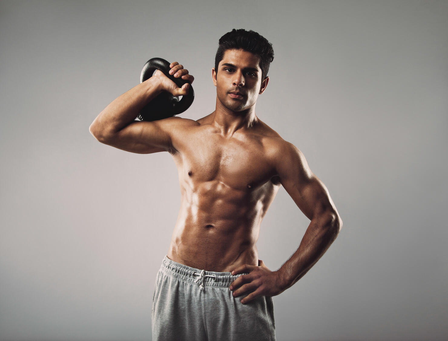 Young muscular man doing gym workout