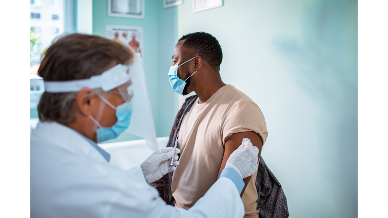 Young man getting vaccinated