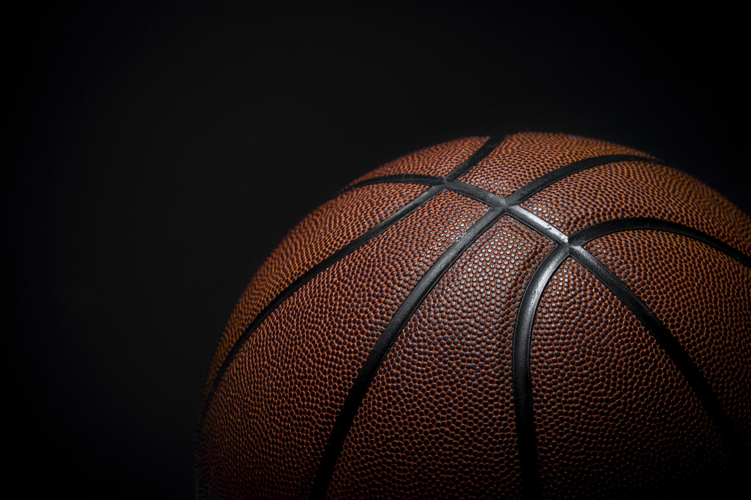 Closeup detail of basketball ball texture background