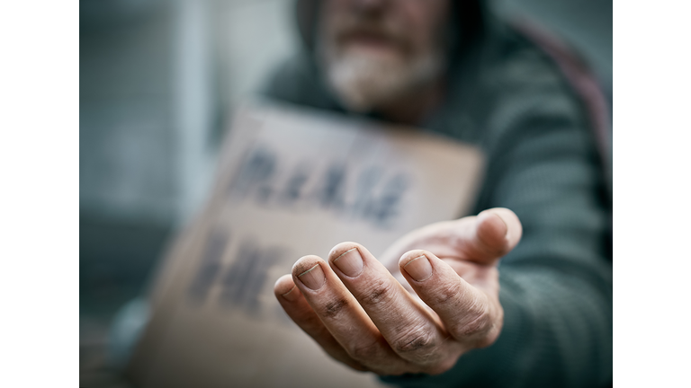 Outstretched hand of pathetic beggar