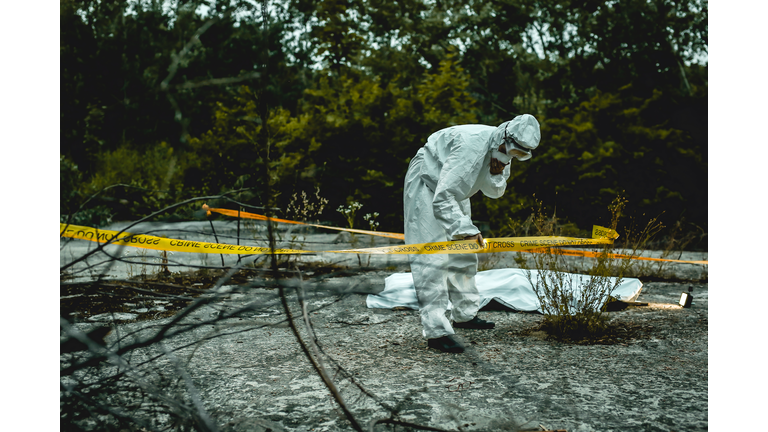 crime scene investigation, forensic examines the corpse