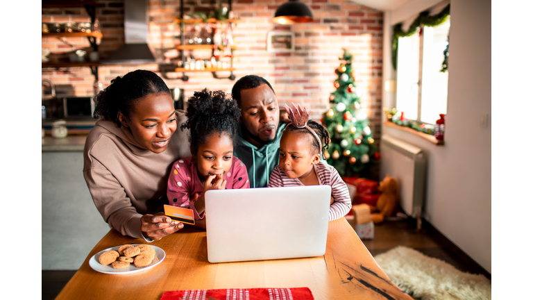 Young family online Christmas shopping