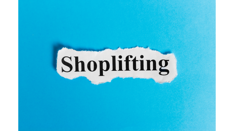 shoplifting text on paper. Word shoplifting on a piece of paper. Concept Image.