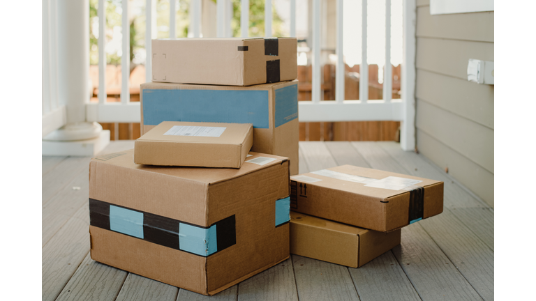 Stack of packages on front porch after mail delivery