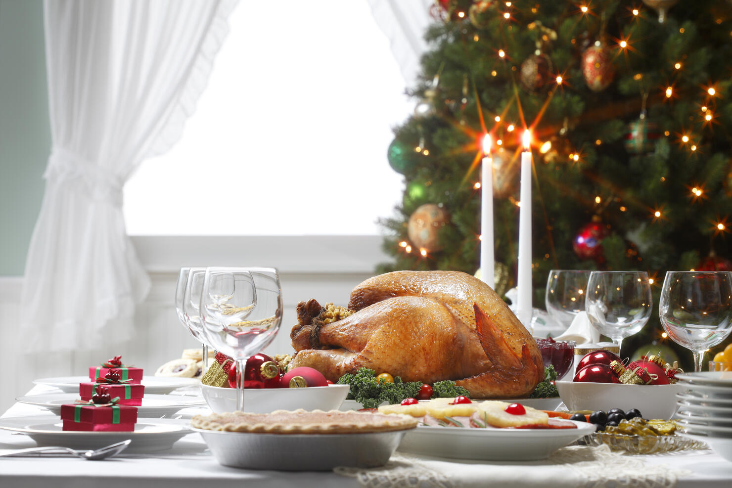 Christmas Dinner Table Spread and Christmas Tree