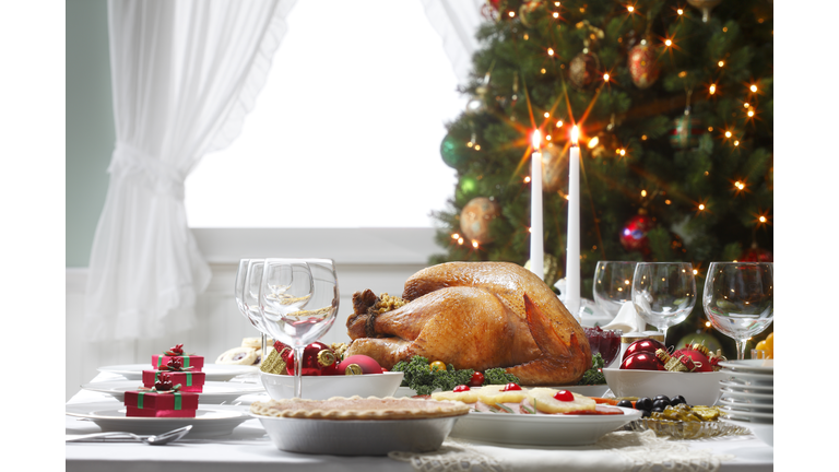 Christmas Dinner Table Spread and Christmas Tree