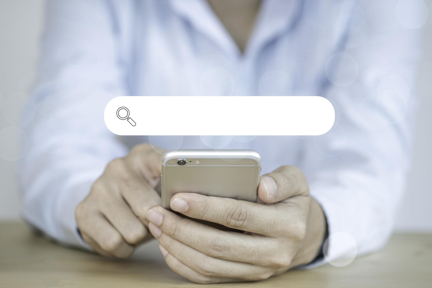 Midsection Of Woman Using Mobile Phone With Search Engine Symbol