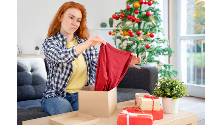 Sad woman disappointed by bad product purchase