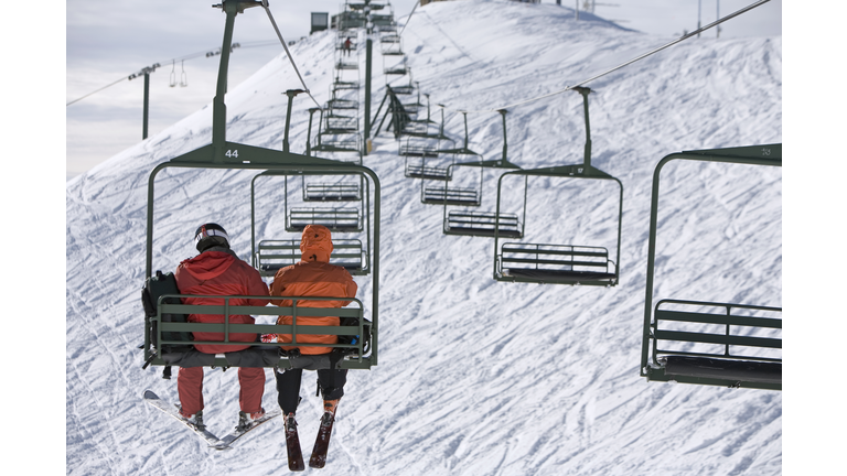 Skiers on a Chair Lift