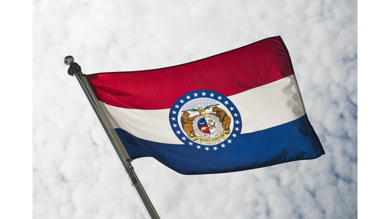 USA, Missouri State flag against sky
