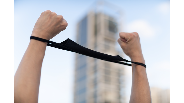 protest mask handcuffs