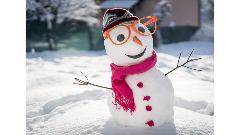 Snowman on snow background