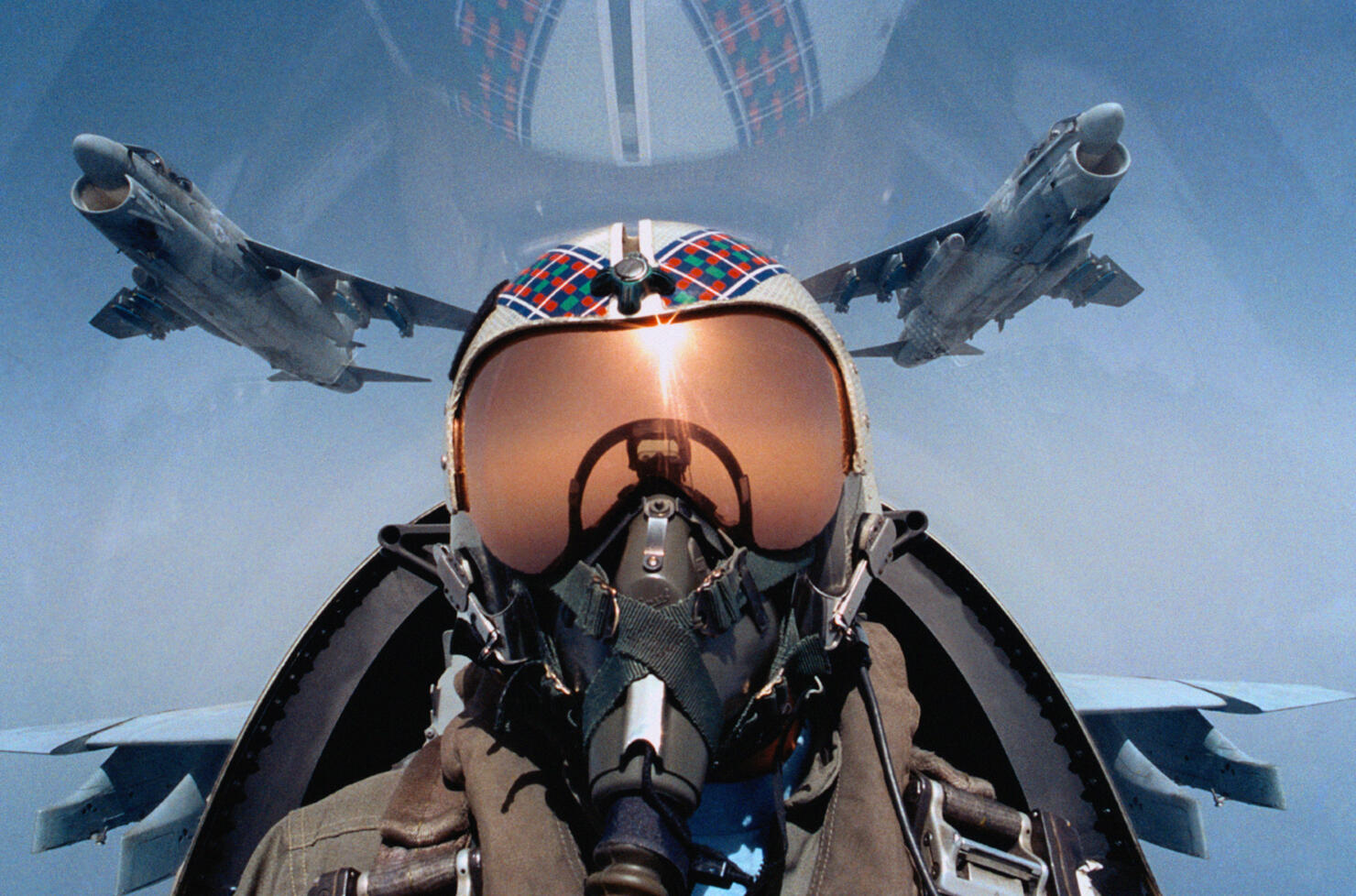 Jet aircraft pilot in cockpit, close-up