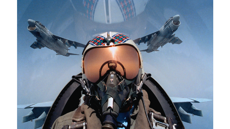 Jet aircraft pilot in cockpit, close-up