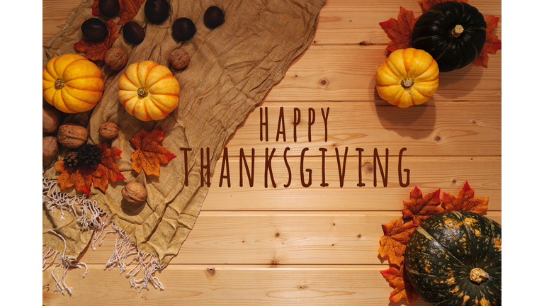 Happy Thanksgiving Day With Pumpkin And Nut On Wooden Background