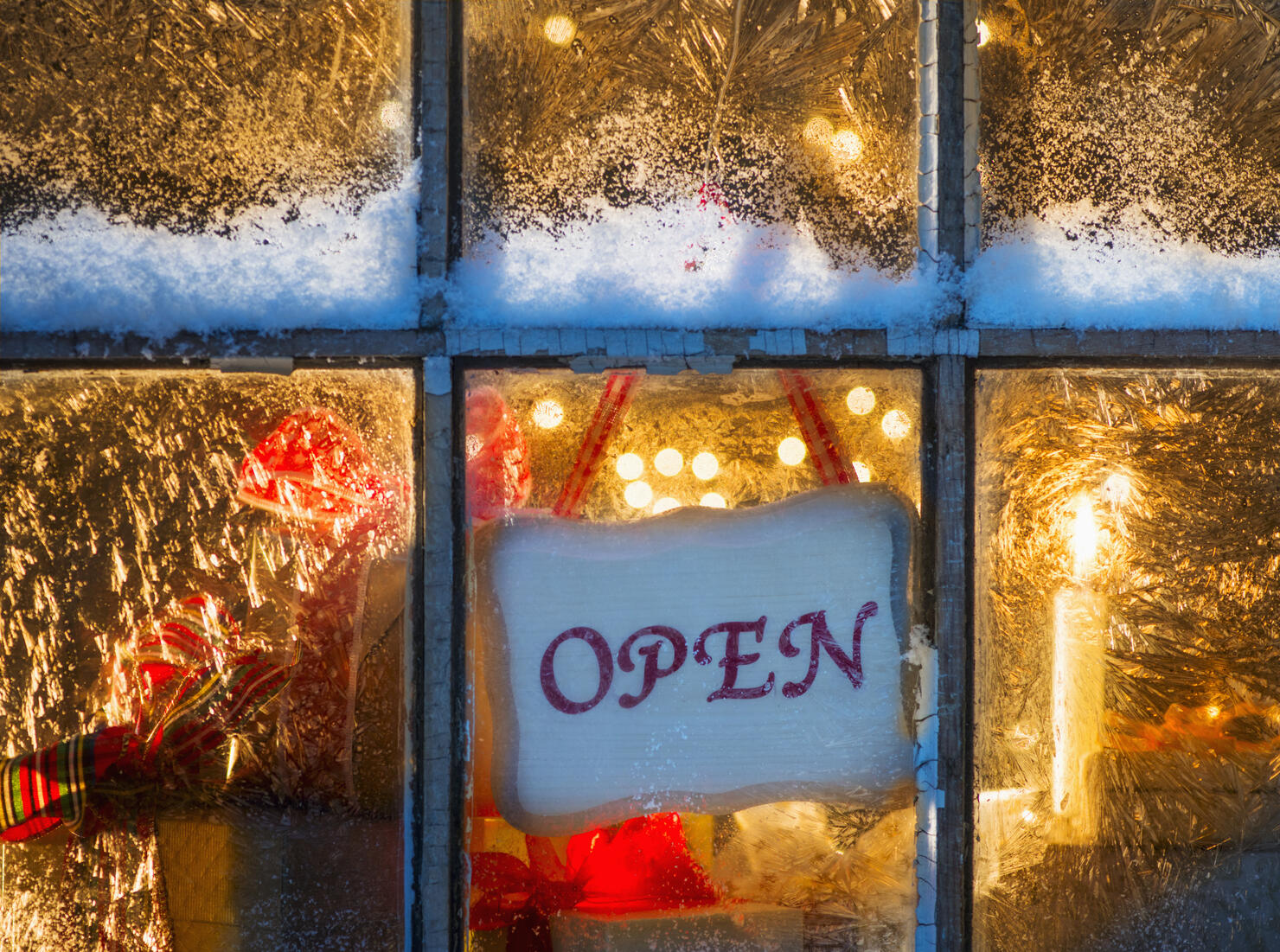 USA, New Jersey, Open sign hanging in window with Christmas lights