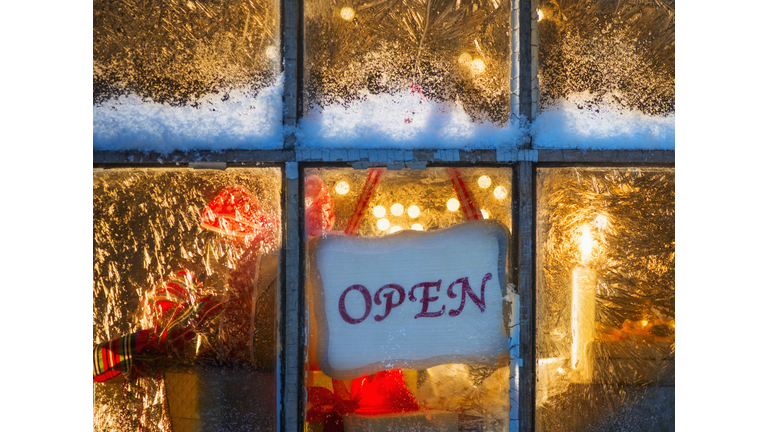 USA, New Jersey, Open sign hanging in window with Christmas lights