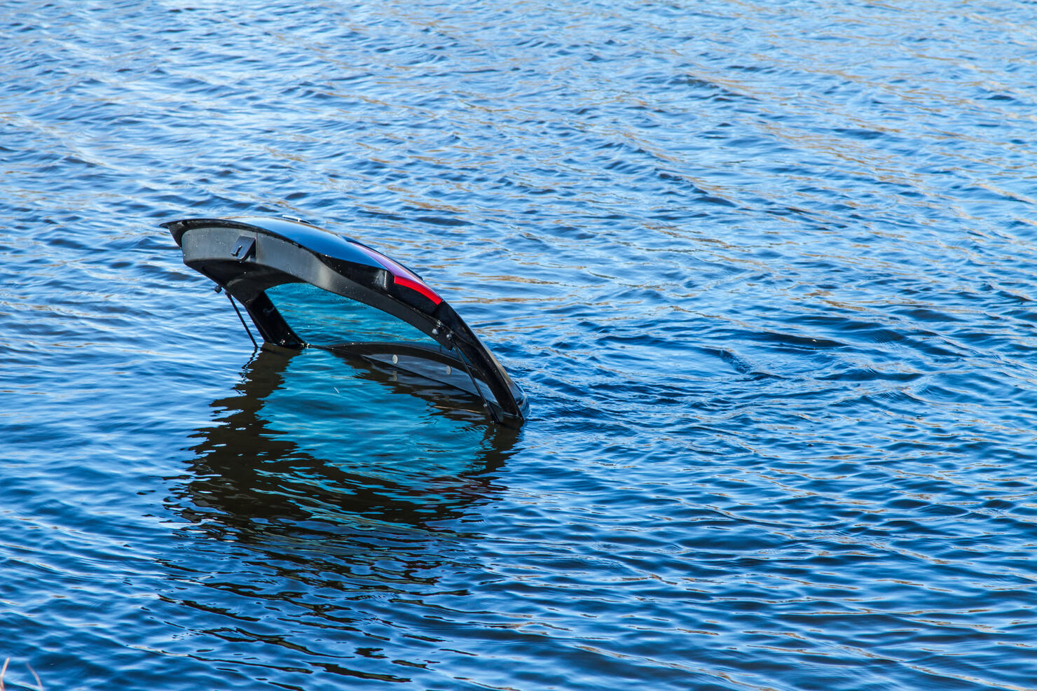 High Angle View Of Car Drowning In Lake