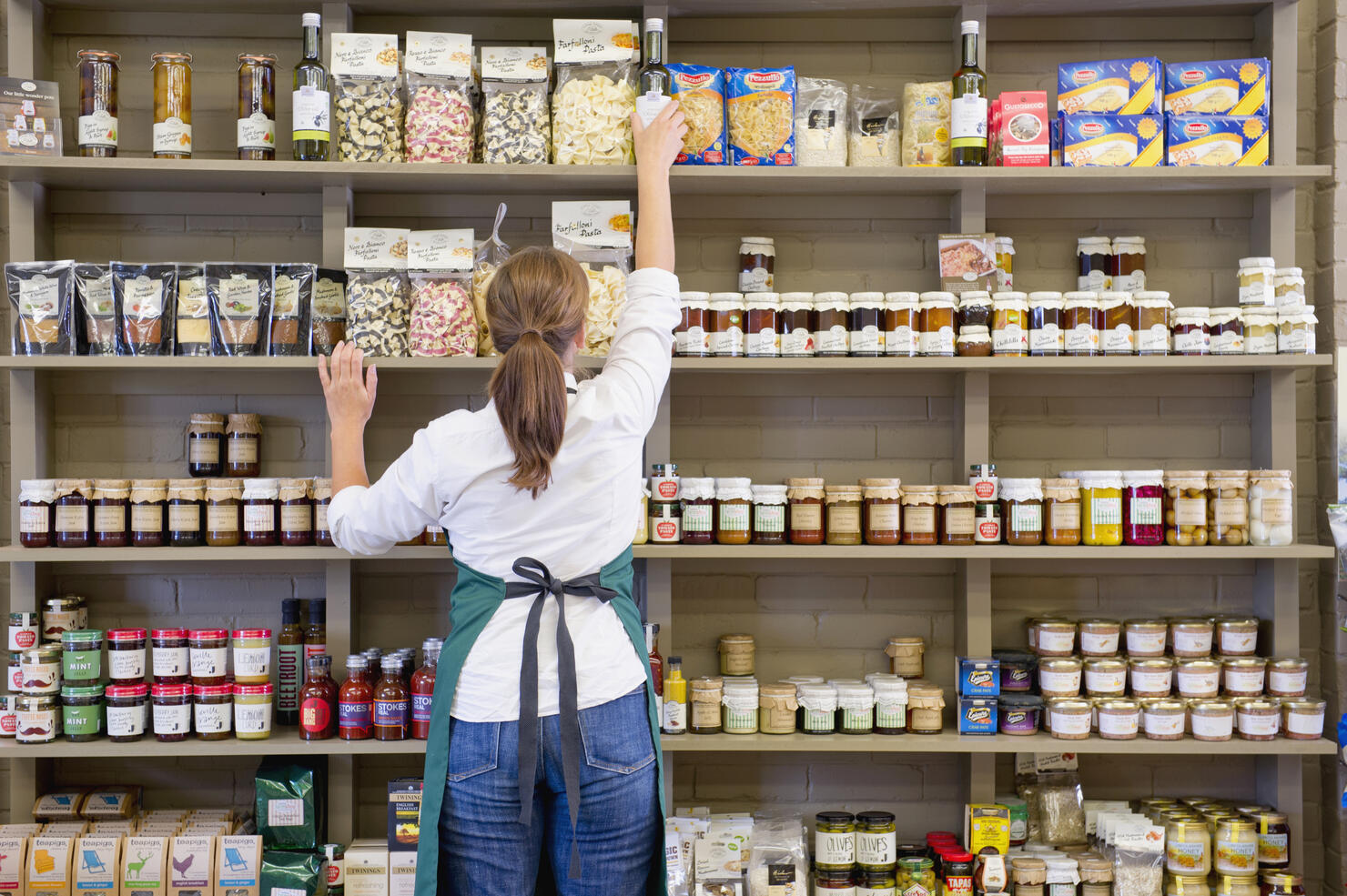 Caucasian clerk working in grocery store