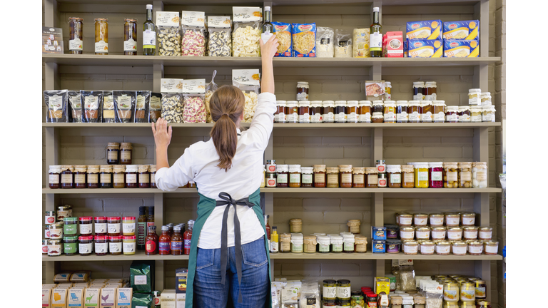 Caucasian clerk working in grocery store