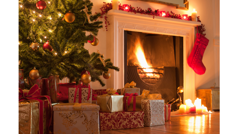 Christmas tree and stocking near fireplace