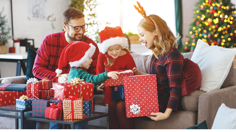 happy family   open presents on Christmas morning