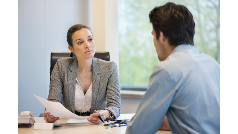 Business executive discussing with her client