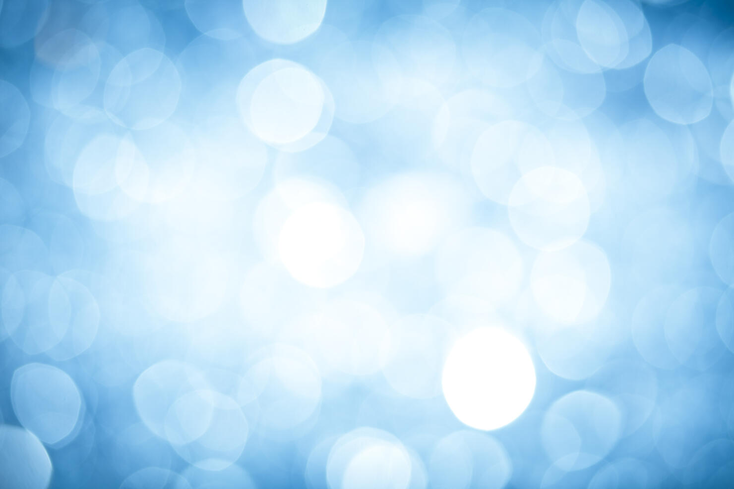 Abstract background with blurred blue sparkles