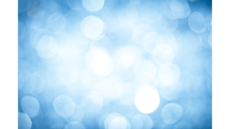 Abstract background with blurred blue sparkles