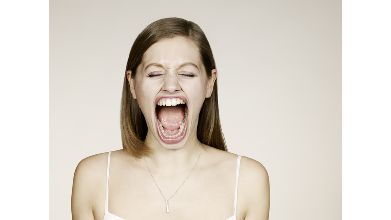 Woman shouting with big mouth