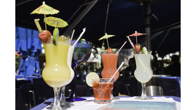 Cocktail glasses on table in outdoor bar