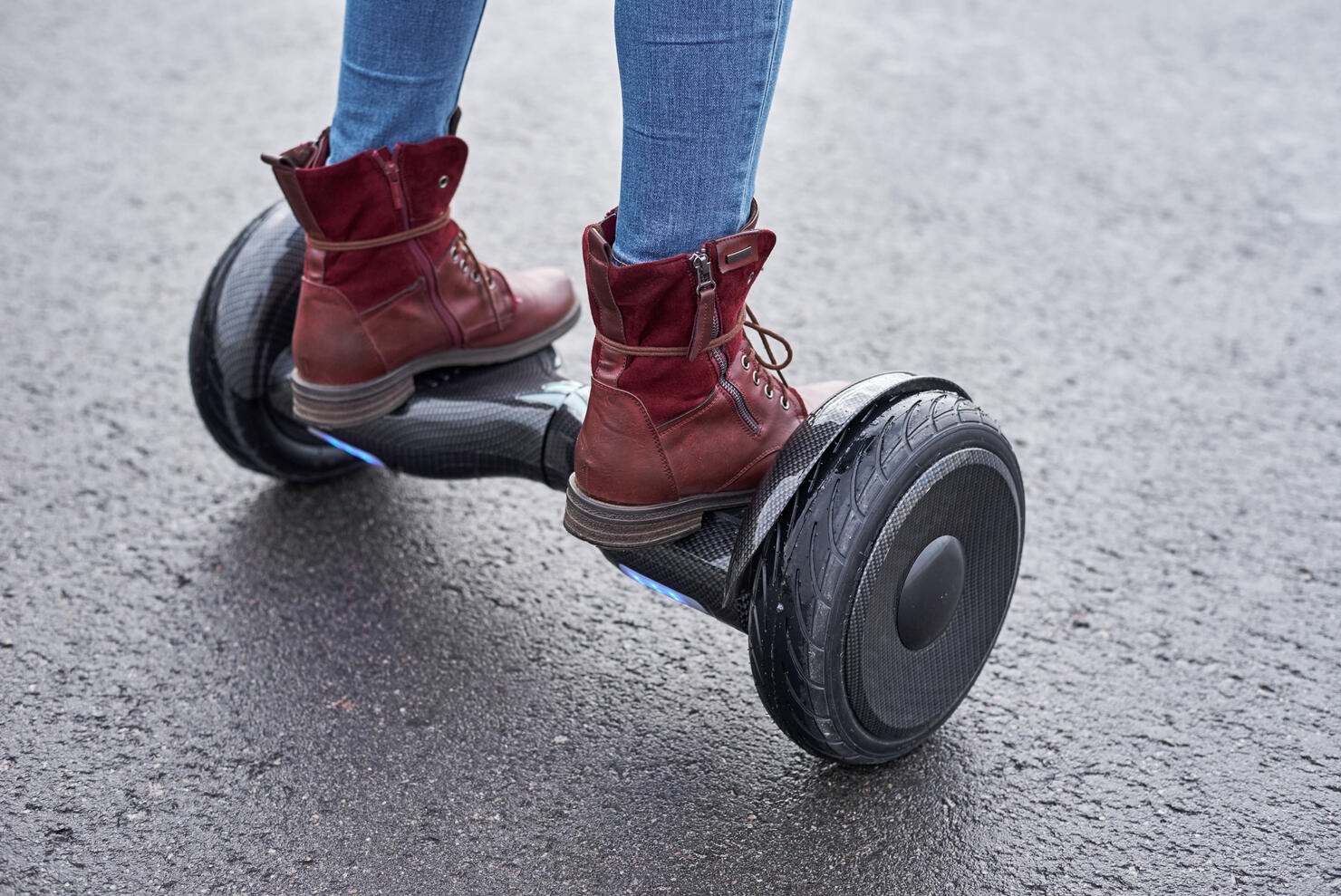 Low Section Of Woman Standing On Hoverboard On Street