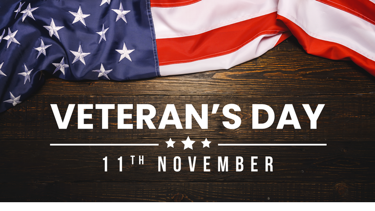 Veterans day. Honoring all who served. November 11 lettering with American flag on old wood background or backdrop