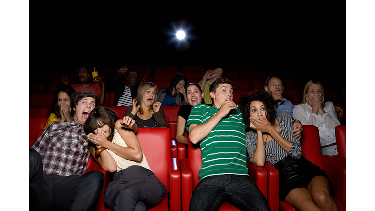 Shocked couples in the movie theater