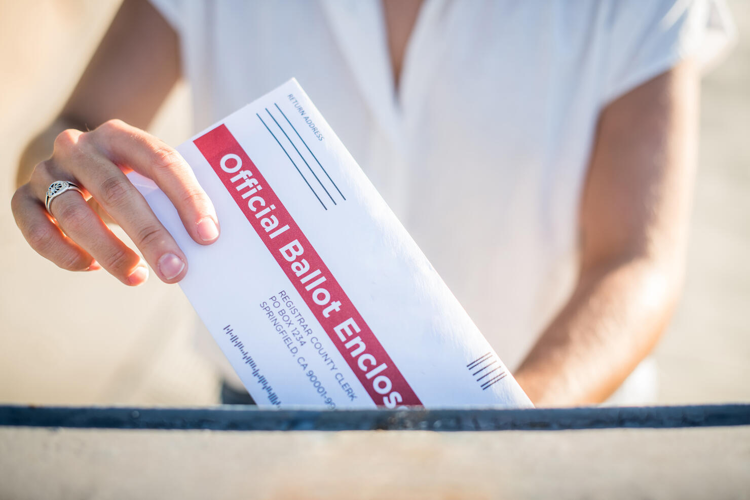Woman Mailing Her Absentee Voter Ballot