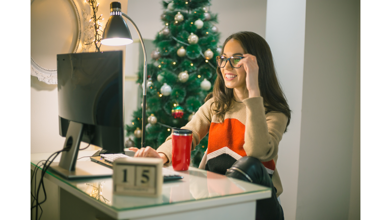 business woman businesswoman freelancer working at a computer at Christmas