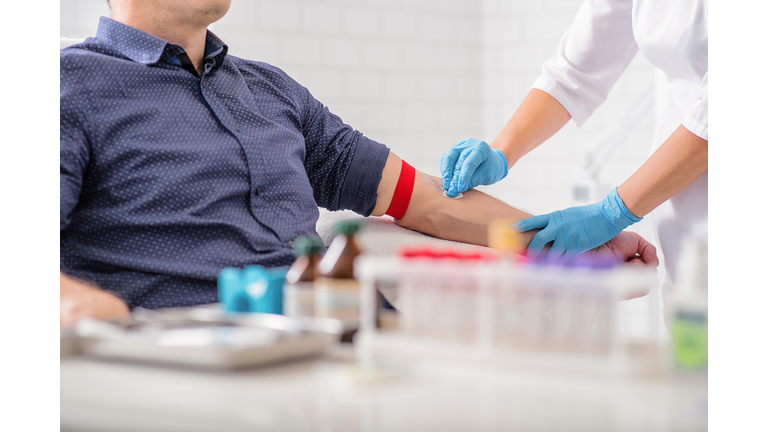 Professional doctor preparing patient for procedure