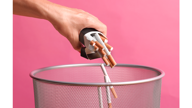 Woman giving up smoking through illness
