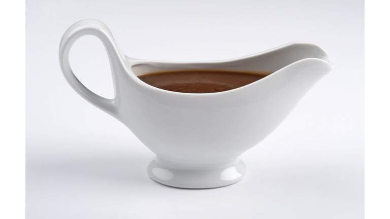 White china gravy boat on white background